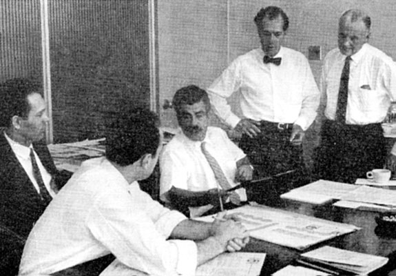 Carl Dair (c.) discusses entries with (l. to r.) judges Gerard Caron and Ernst Roch, and codirectors Gerry Moses and Leo Consedine.